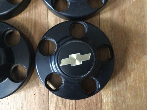 Set of 4- 1988-99 chevy 1500 black centers, 46249