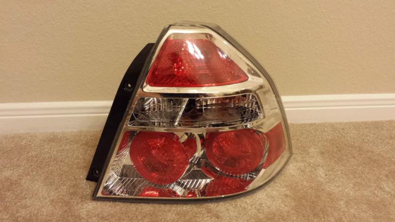 2009-2011 chevy aveo sedan rh passenger side tail light complete oem