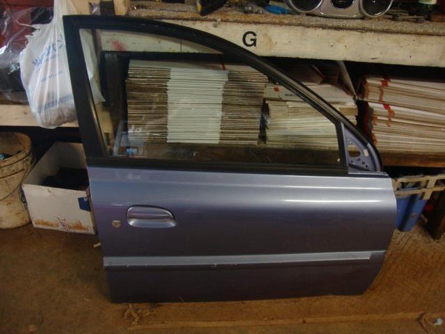 2004 kia rio 4dr sedan passenger side front door oem