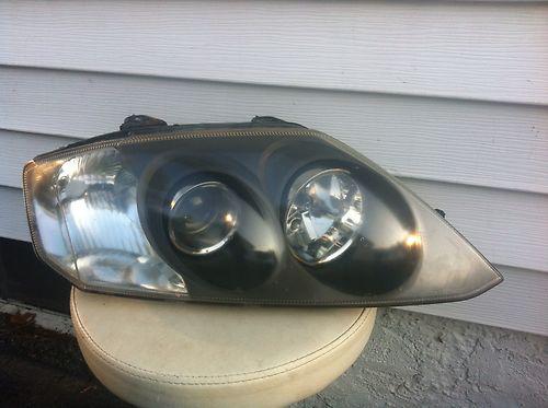 Hyundai tiburon headlight assembly 03 04 passenger / right