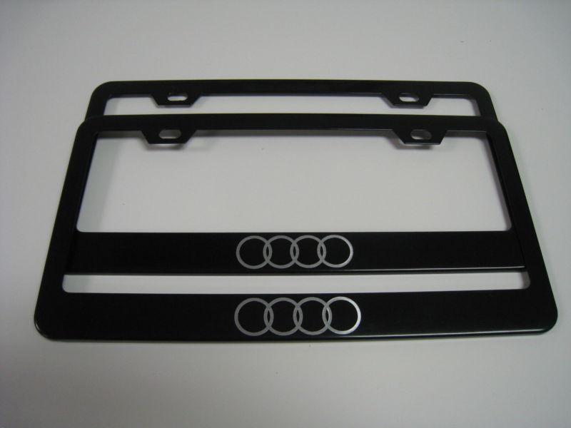 (2) black coated metal license plate frame - audi "logo"