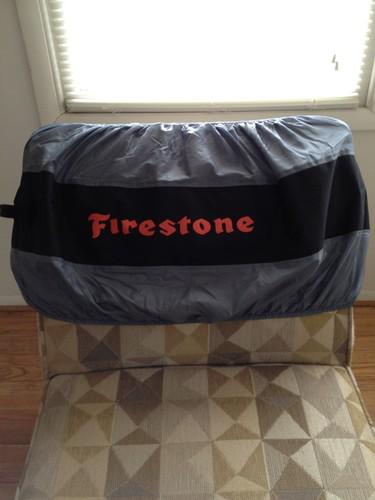 Kurgo seasonal tire tote with a firestone logo- one size fits 21-33" tire