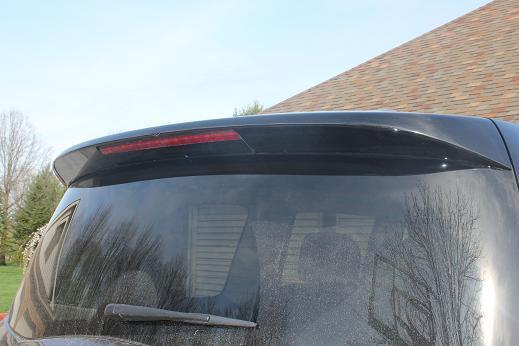 Infiniti qx56 black rear spoiler, slight crack, easy fix , $700 from dealer