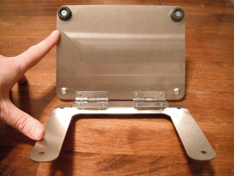 Flip up license plate bracket hinge concealed trailer hitch fuel roll pan frame