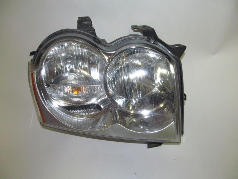 05 06 07 jeep grand cherokee right headlight nice!