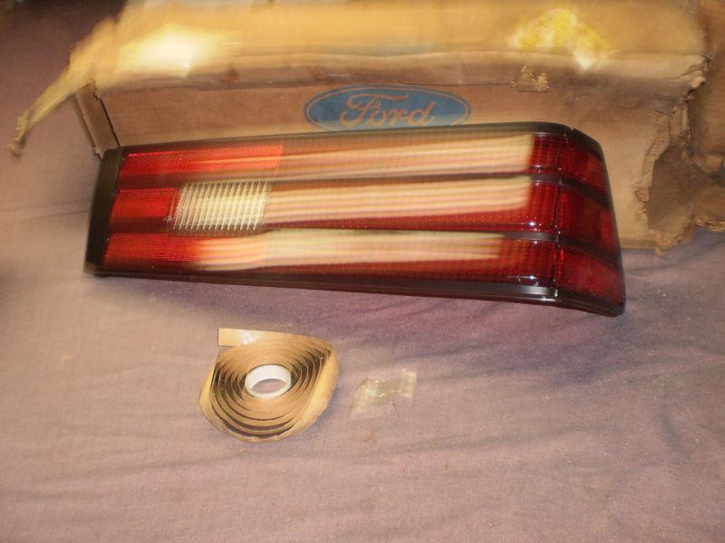 Escort gt 88, lynx 87, taillamp lens rh orig. ford nos