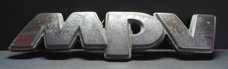 Used genuine mazda "mpv" rear emblem nameplate fits 1992 - 1998 #l003-51-720