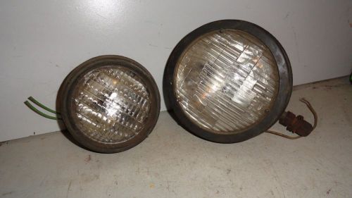 Pair of small garden tractor lamps.5&#034; dia. lamp is all rubber.7&#034; has metal bowl