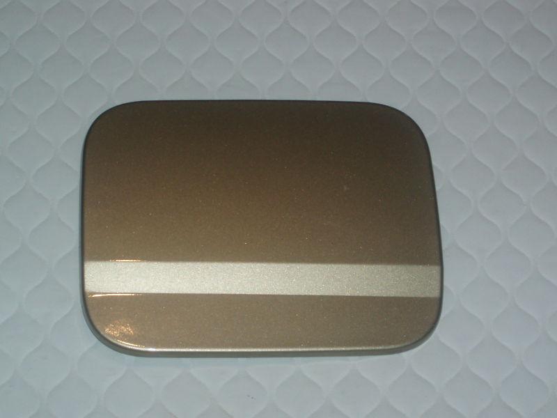 Daewoo nubira gas tank door  gold  2000-2002