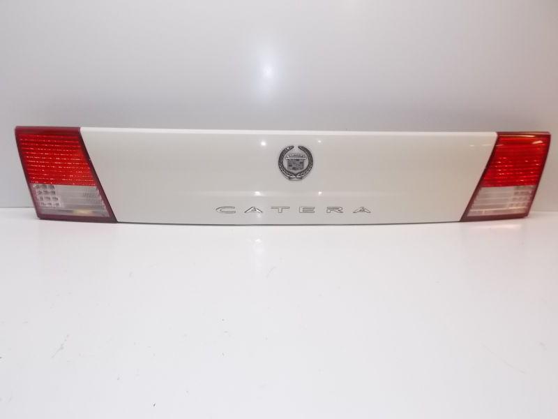 00 01 cadillac catera tail light rear deck trim panel taillight white color oem