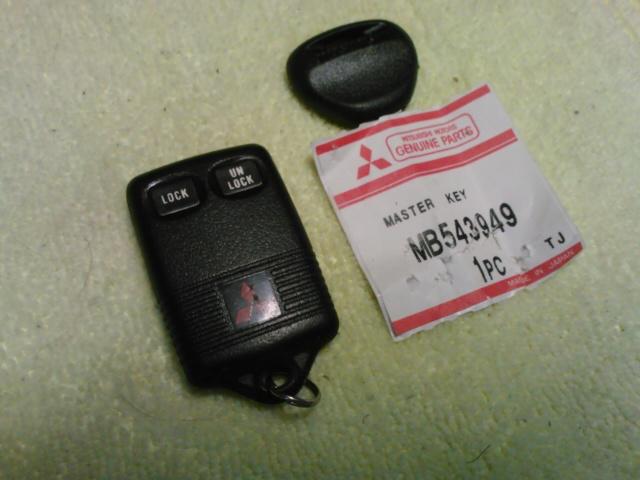 Used mitsubishi montero galant keyless remote and brand new master key blank