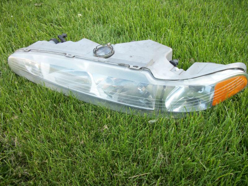 Used 1998 oldsmobile intrigue head light assembly - driver side right lamp