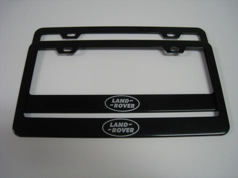 (2) black coated metal license plate frame - land rover "logo"