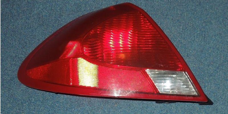 >>>>oem right side tail light for a 2001 ford taurus<<<<<