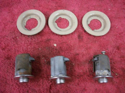 1968-up rear storage comapartment locks with bezels, used