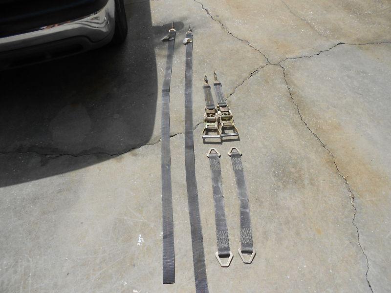 Pair of ratcheting car tie downs with axle straps