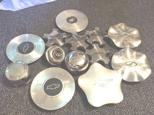 Lot of 13 center caps chevy,buick mustang,and more