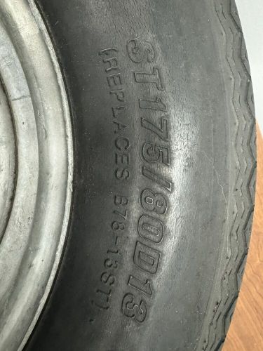 Trailer tire &amp; rim st175/80d13 max load 1360 pounds at 50 psi.