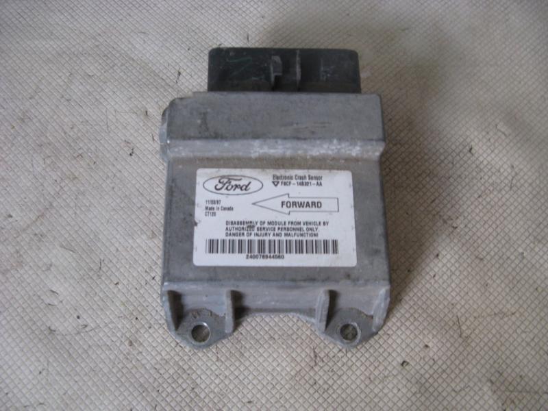 98 99 00 01 02 03 escort chassis ecm air bag ctr of dash below heater/radio