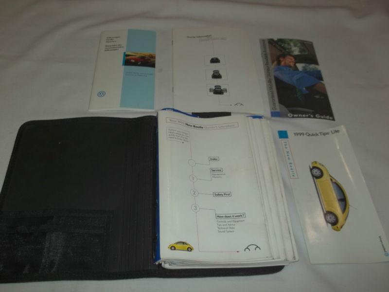 1999 vw new beetle owner's manual set & black vw 4 ringed binder factory case.