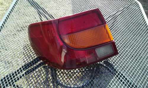 Saturn s tail light driver side oem. 2000,2001,2002