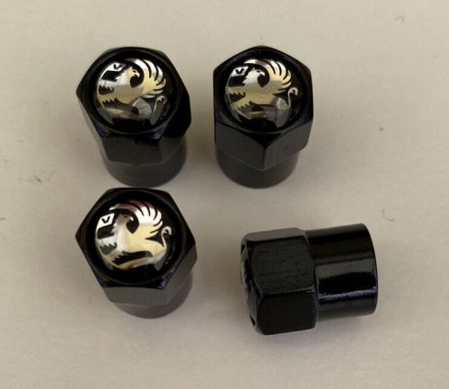 **free post** vauxhall black with black  badge tyre valve/dust caps --set of 4.