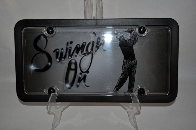 "swing on" golfing  license plate tag frame