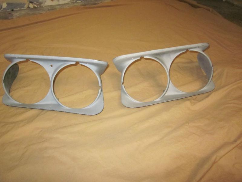 68-72 corvette rh/lh headlight bezels w/ & w/o washer holes 3911144/3911143 oem