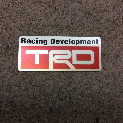 Trd red satin aluminum car sticker size 3.22&#034;x1.37&#034;, thickness 0.01&#034;.